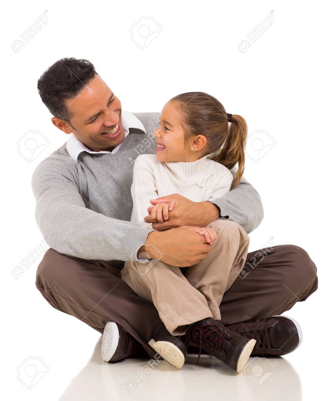 daughter sits on dads lap